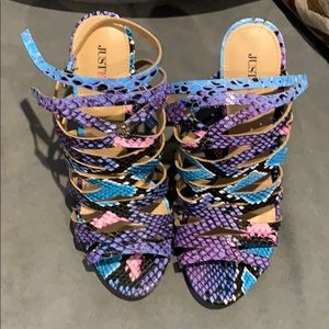 High-heeled, multi-colored sandals.